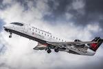 Air Canada Express CRJ200 in cloudy skies