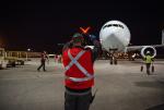 Air Canada marshaler in front of plane