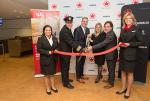Air Canada employees cutting the ribbon to celebrate the Airbus A220